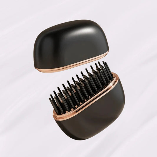 Black hairbrush with rose gold accents on a light gray background