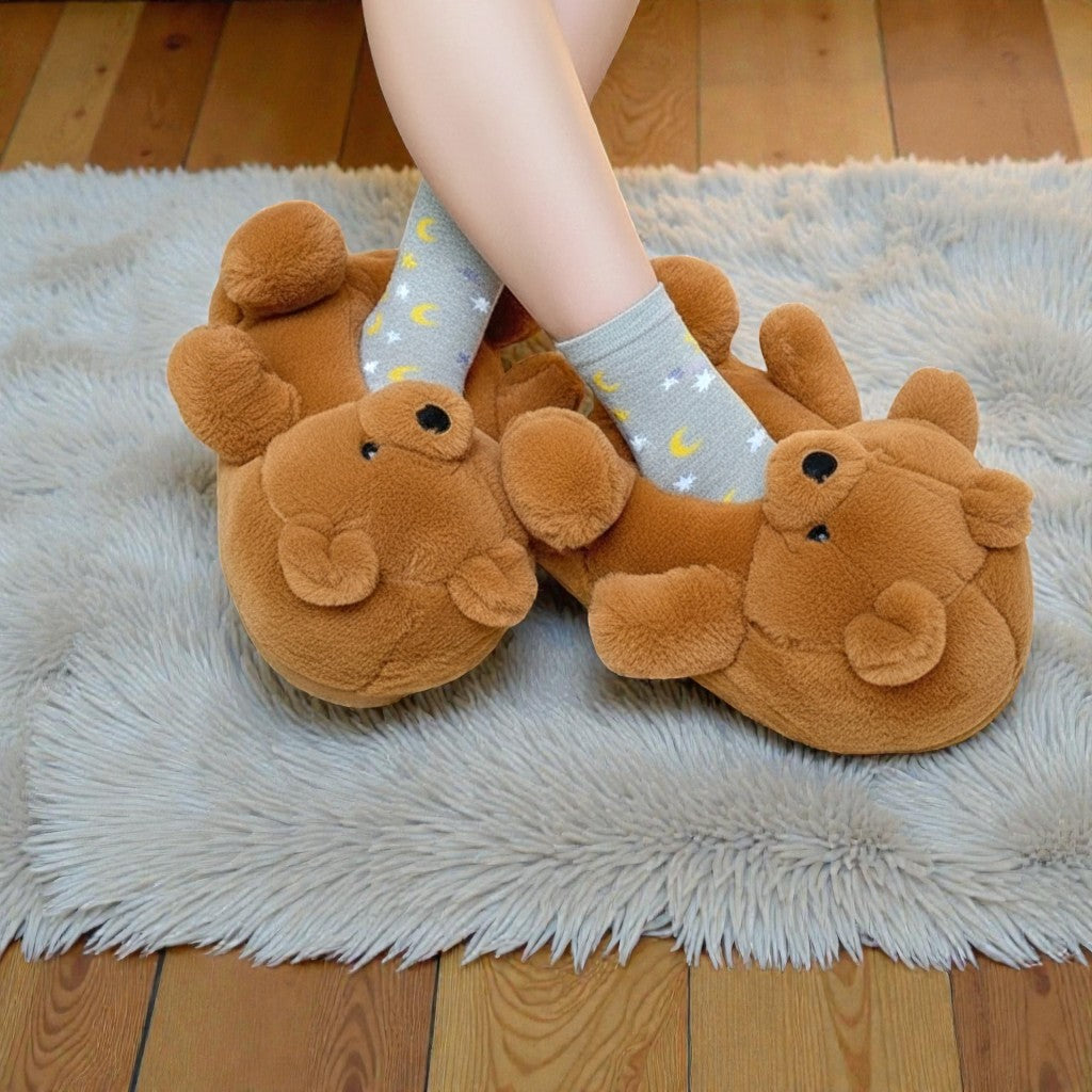 Brown bear slippers worn on a fluffy rug with wooden floor.