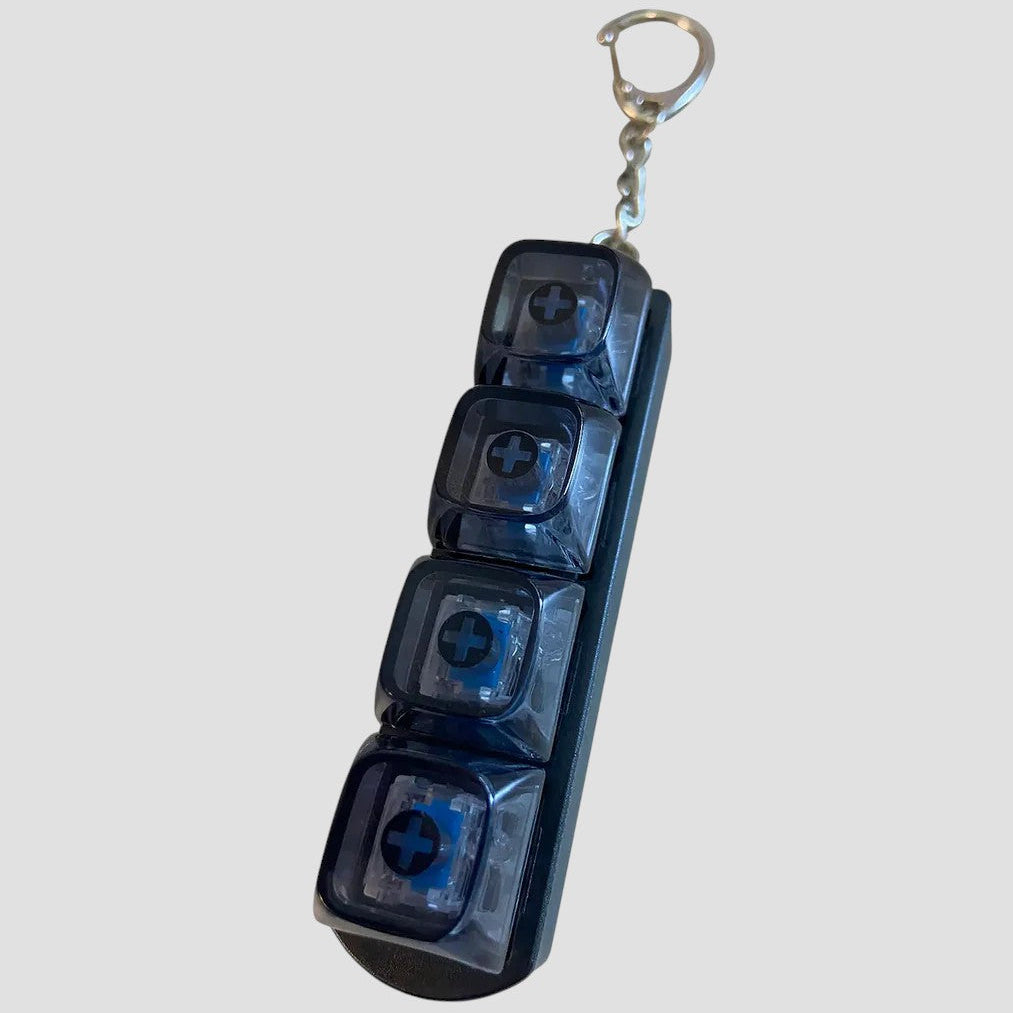 Blue keychain with four transparent sections on a white background