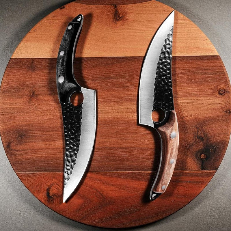 Two knives with textured handles on a wooden cutting board