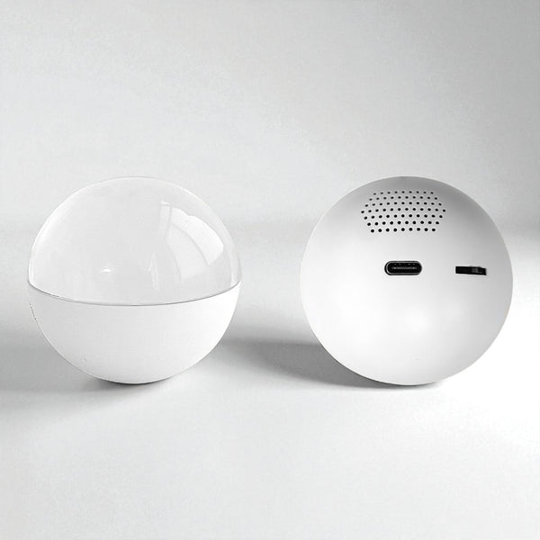 Two white spherical VIDEO PLAYER BALL on a light gray background