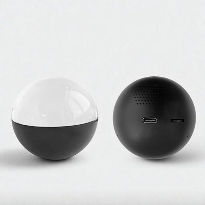 Two spherical video player ball, one black and one with a transparent top, on a light gray background.
