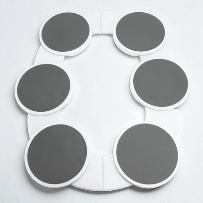 Circular object with gray and white sections on a light gray background