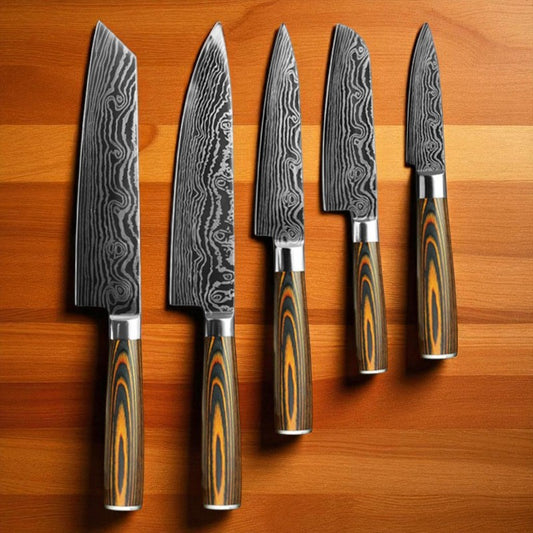 Set of five Damascus steel kitchen knives with wooden handles on a wooden surface