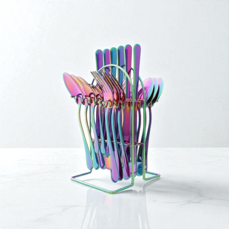 Colorful metal spoons in a stand on a white background