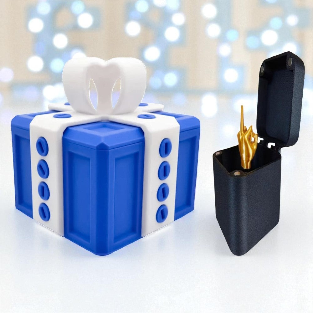 Blue and white gift-shaped container with a white tooth inside, next to a black case with gold items on a blurred light background.