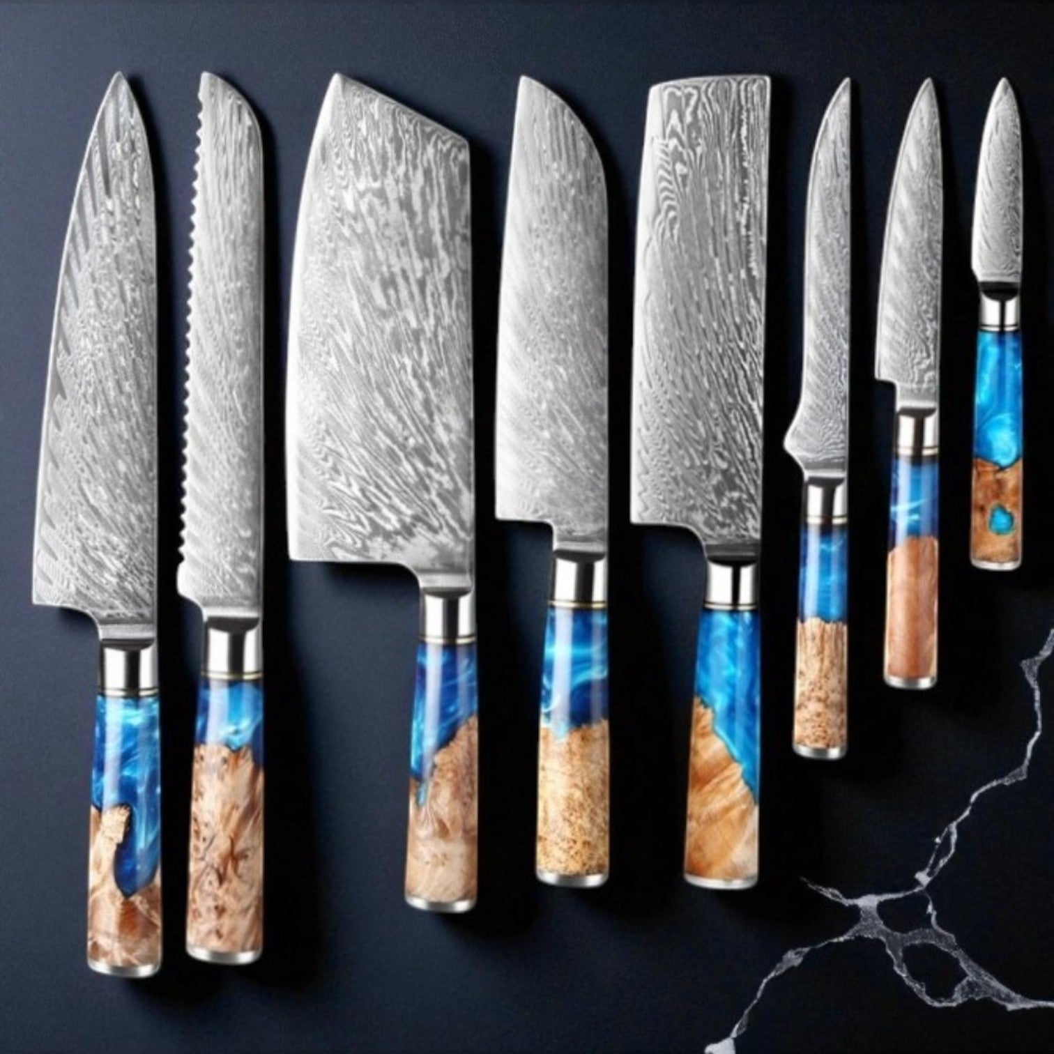 Set of Damascus steel kitchen knives with various handle designs on a dark background